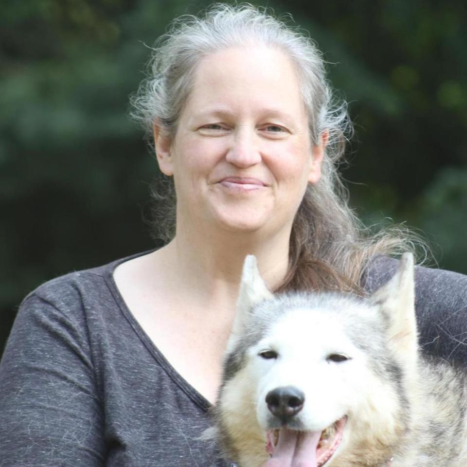 Tanya McCready. Headshot of Tanya McCready posing with her Dog.