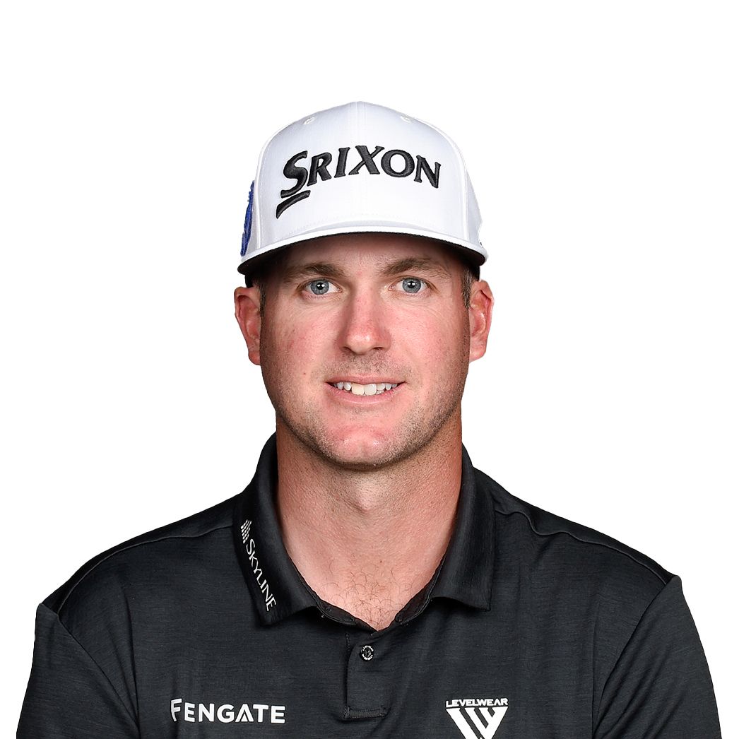 Typer Pendrith. Headshot of Tyler Pendrith wearing a black collared shirt and a ball cap that says "SRIXON". He is posing in front of a bright white backdrop.