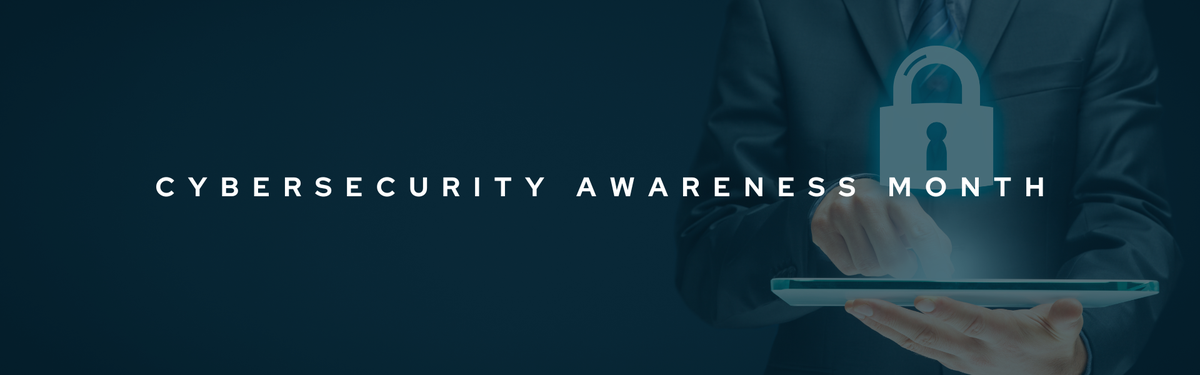 Decorative banner that reads "Cybersecurity Awareness Month" in bold white font. The background image shows a man in a suit holding an electronic tablet and pointing at the screen.