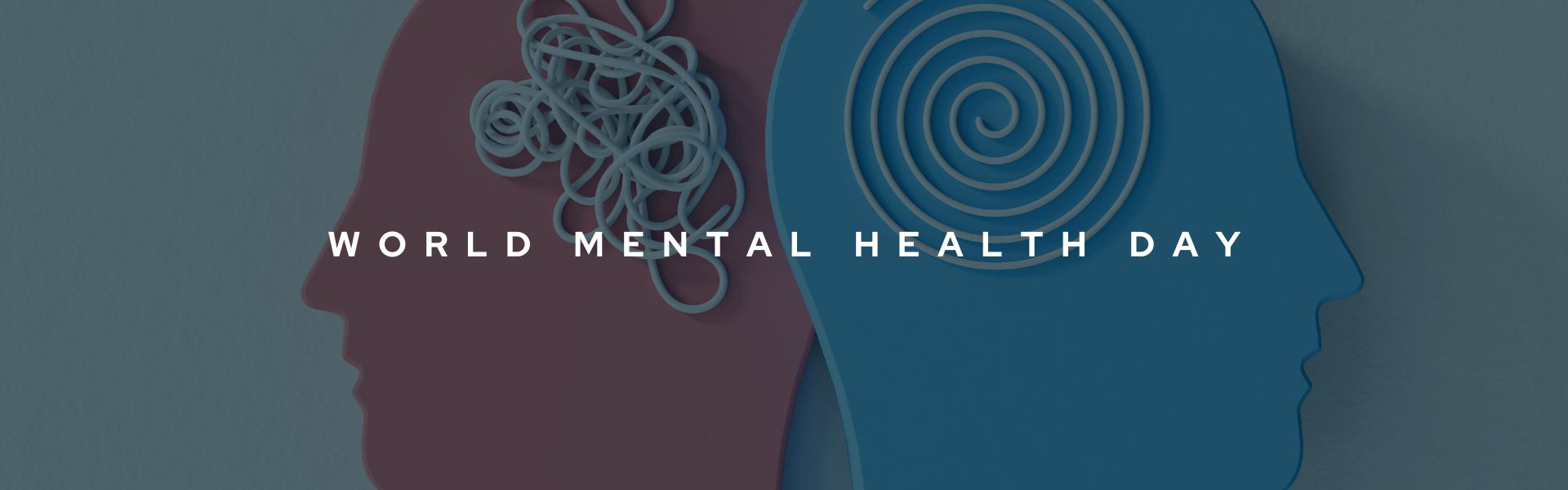 Decorative banner that reads "World Mental Health Day" in bold white text. The background image includes graphics of the silhouettes of the side profiles of a pink and blue human.