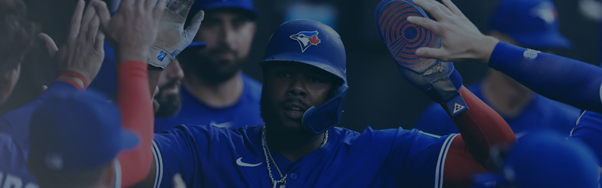 Decorative banner of the Toronto Blue Jays baseball players high-fiving Vladimir Guerrero Jr.